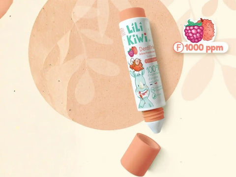 Dentifrice bébé à la framboise et litchi LiliKiwi, tube blanc avec logo coloré, pour renforcer et protéger l'émail dentaire.